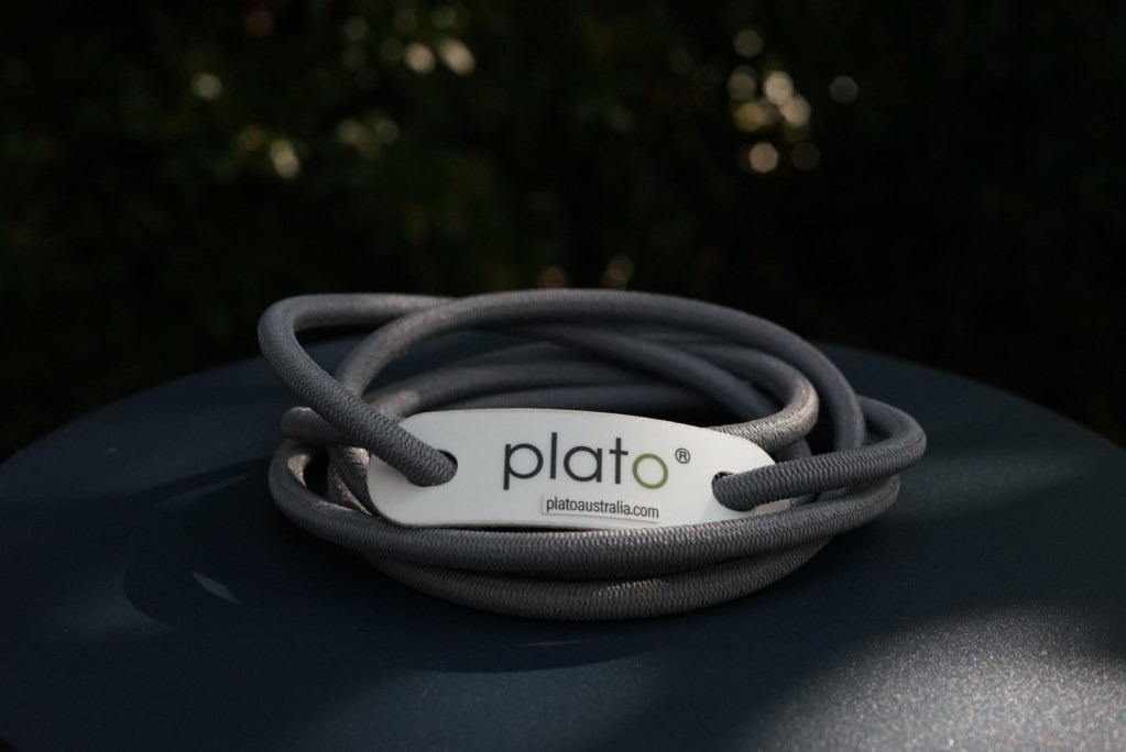 tensioner in grey finish displayed outside on a dark blue steel stand